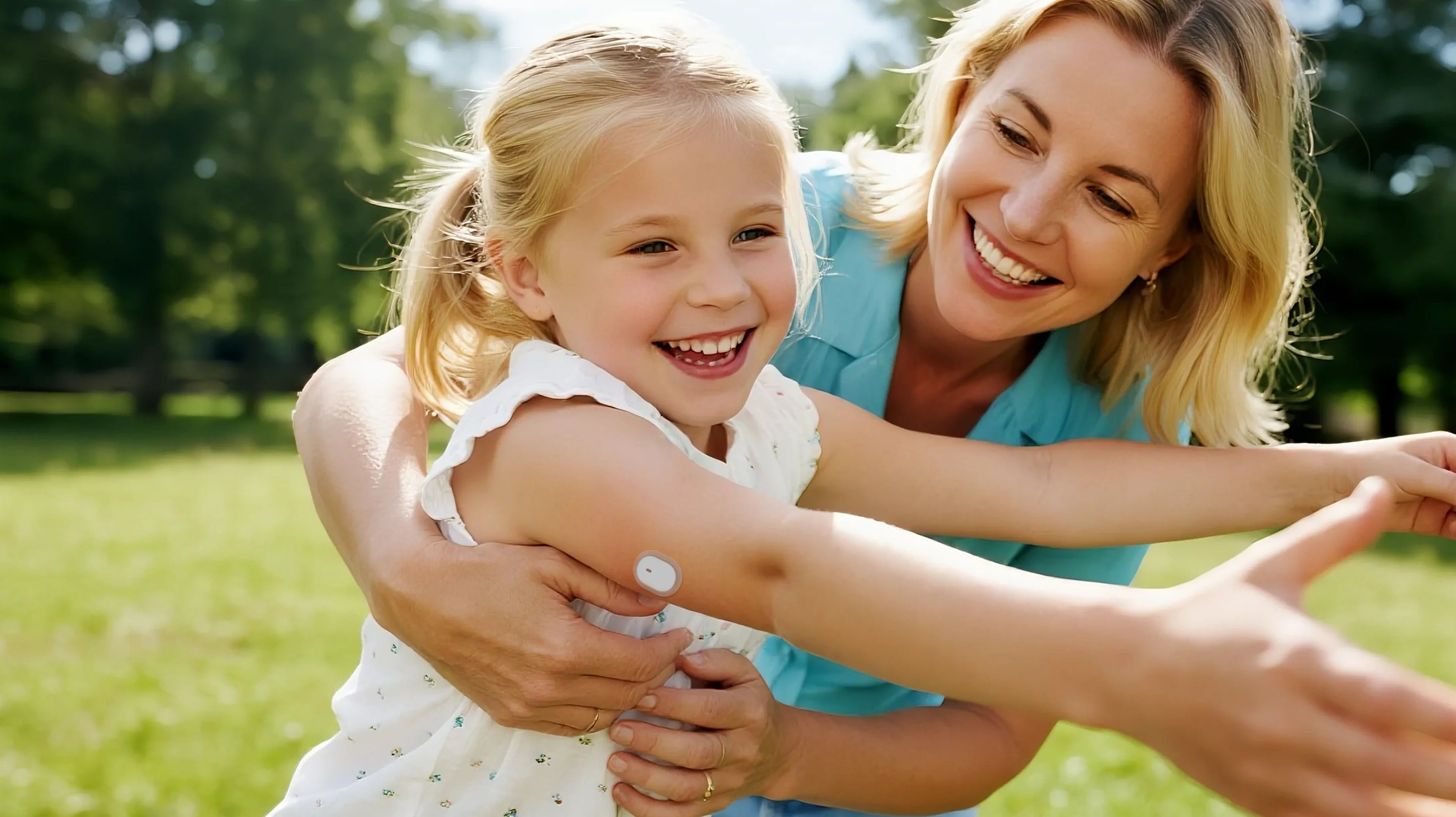 A child with a Sibionics glucose monitor on her arm smiles outdoors with an adult.